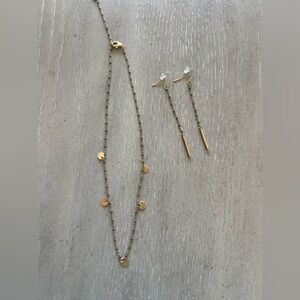 Gold necklace with dark grey beads and matching earrings